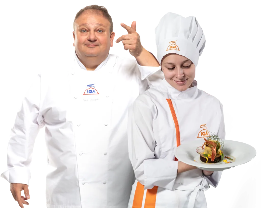 Chefs do IGA Salvador de dólmã, com prato finalizado